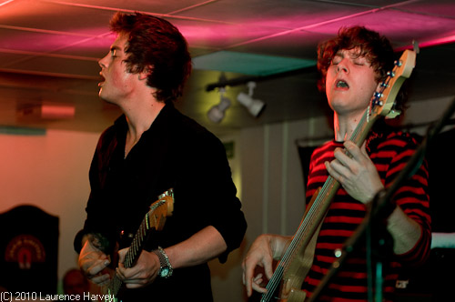 Virgil McMahon on lead guitar, Tom Sansbury on bass