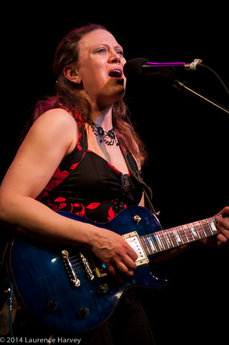 Clare Free on guitar and vocals