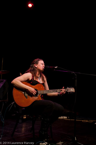 Clare Free on guitar and vocals