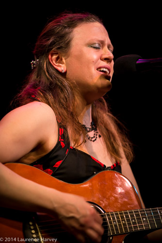 Clare Free on guitar and vocals