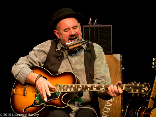 Trevor Steger on acoustic guitar and harmonica
