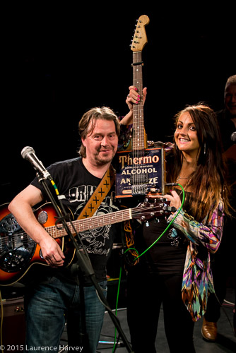 Cherry Lee Mewis & Nick Slater showing off Nick's unusual guitar