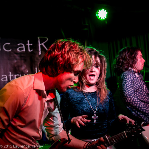 Alex Butler on guitar, Jane Pearce on vocals & Mike Topp on bass