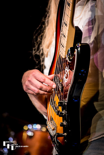 Close-up of Jamie Mallender's bass action