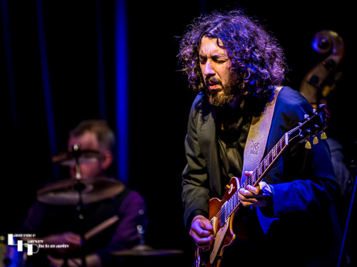 Kid Carlos on guitar