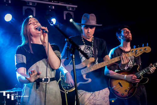 Emma Barney on vocals, Philip van den Brandeler on bass, Mikayl Dawood on guitar