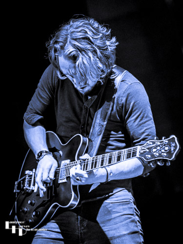 Alex Butler on lead guitar and backing vocals