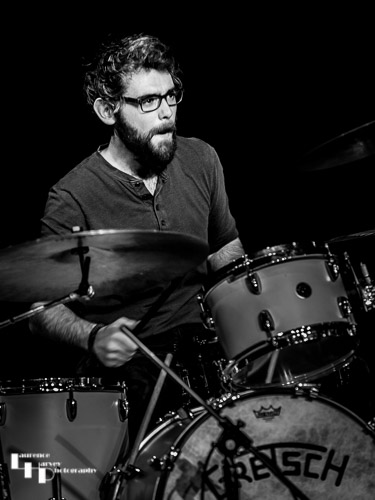 Sam Edwards on drums
