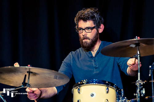 Sam Edwards on drums