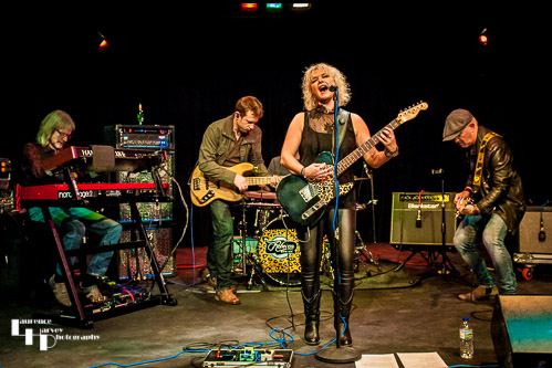 Rebecca Downes & her band on stage at The Limelight Theatre