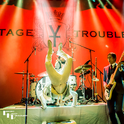 Ty Taylor somersaulting off the drum riser