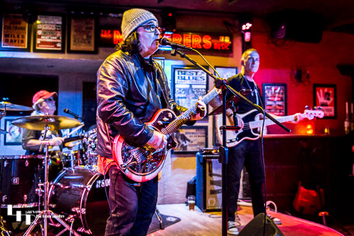 Big Gilson & his band on stage at The Murderers