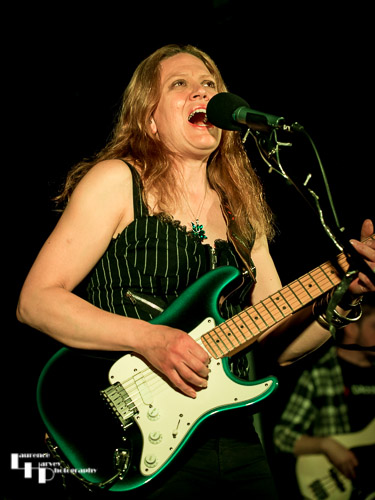 Clare Free on acoustic guitar and vocals