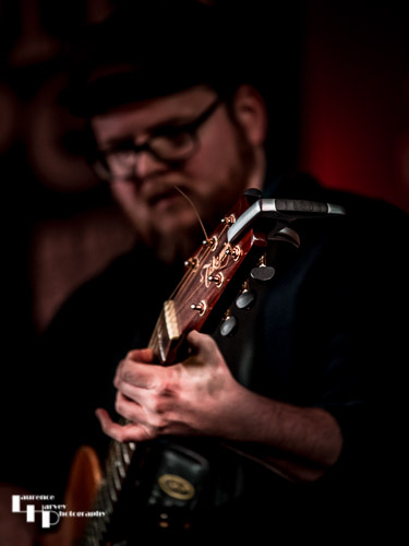 Mark ‘Boweevil’ Howes on guitar