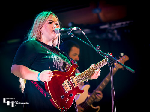 Tori Mai on rhythm guitar & vocals