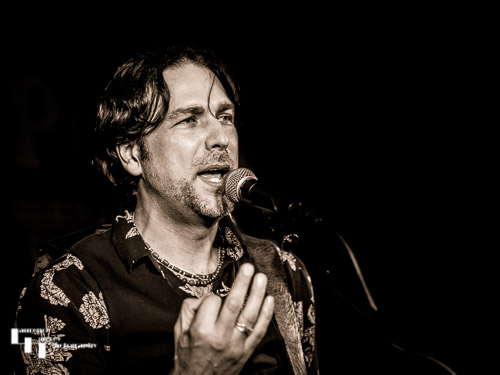 Aaron Bond on guitar & vocals