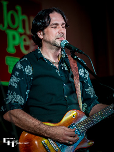 Aaron Bond on guitar & vocals