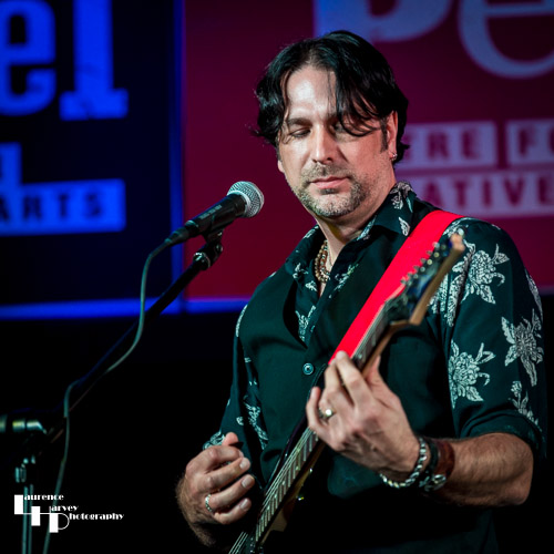 Aaron Bond on guitar & vocals