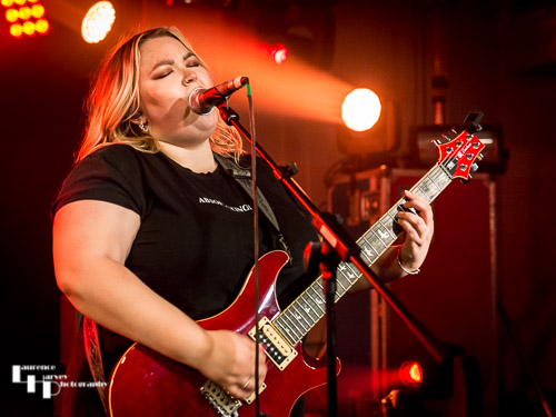 Tori Mai on rhythm guitar & vocals