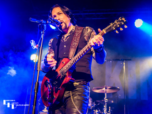 Aaron Bond on guitar & vocals