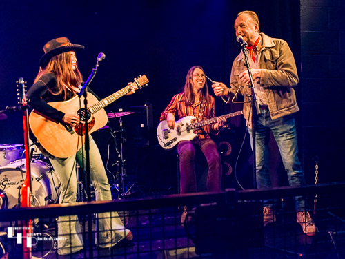 Arielle on vocals & guitar, Devin North on bass & volunteer punter (Glen) on triangle