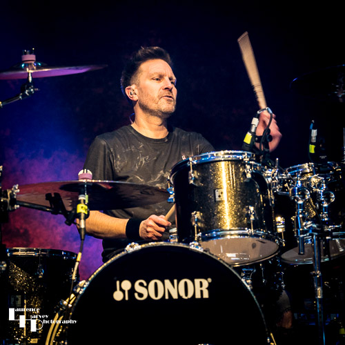 Adam Booth on drums