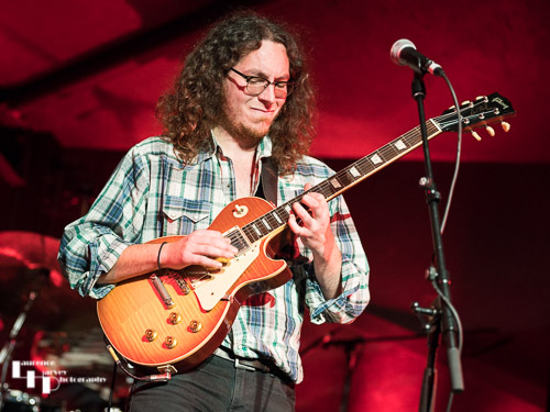 Sam on guitar & vocals