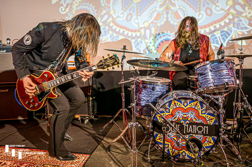 Neil Murdoch on guitar, Nick Sharman on drums