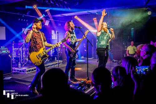 Blacktop Mojo on stage at The Waterfront