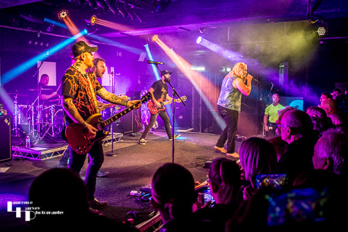 Blacktop Mojo on stage at The Waterfront