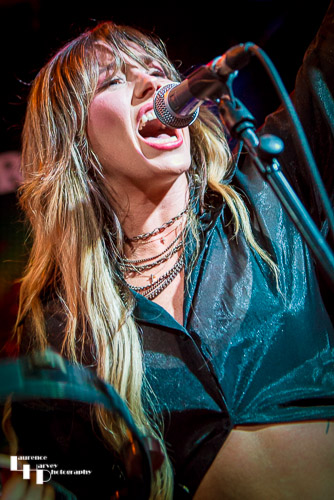 Megan Kane on guitar & vocals.