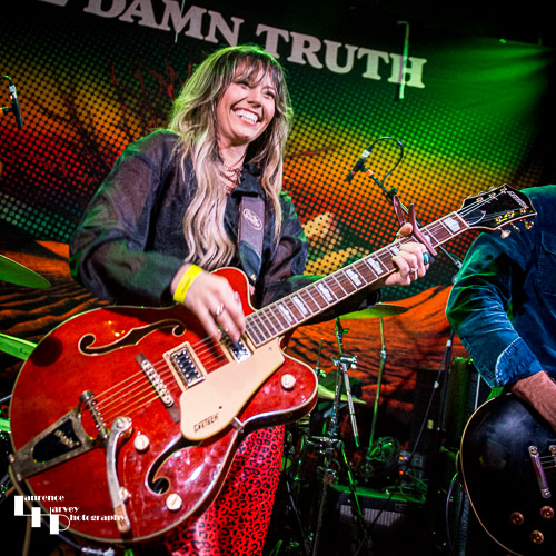 Megan Kane on guitar & vocals.