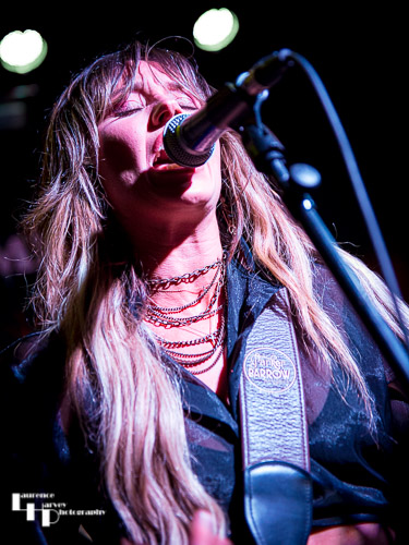 Megan Kane on guitar & vocals.