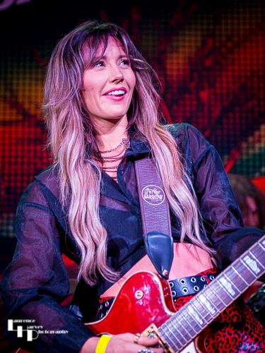 Megan Kane on guitar & vocals.