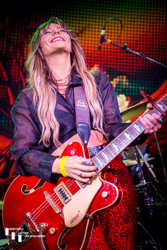 Megan Kane on guitar & vocals.