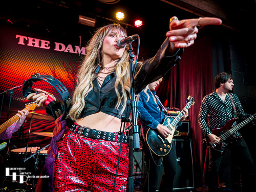 Megan Kane on guitar & vocals.