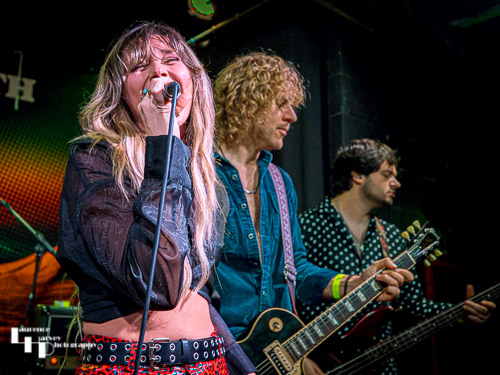 Megan Kane on guitar & vocals.