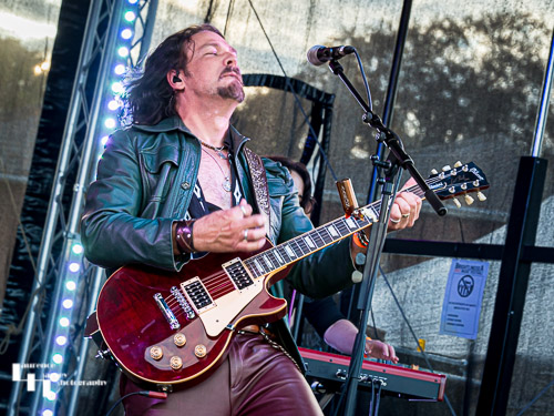 Aaron Bond on guitar & vocals