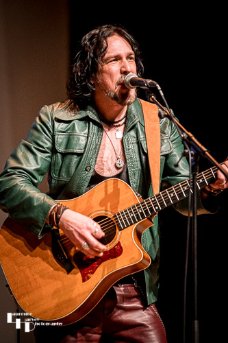 Aaron Bond on guitar & vocals