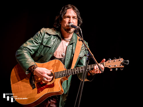 Aaron Bond on guitar & vocals