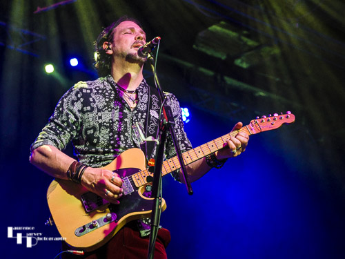 Aaron Bond on guitar & vocals