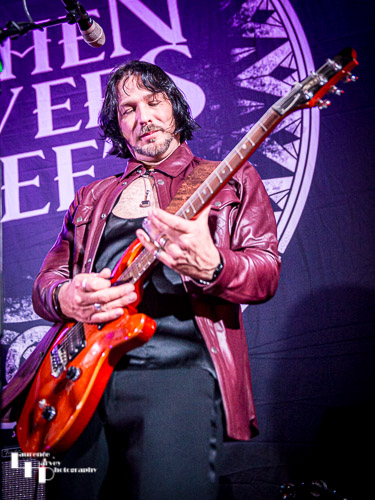 Aaron Bond on guitar