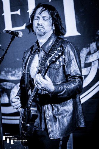 Aaron Bond on guitar
