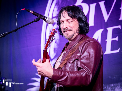 Aaron Bond on guitar