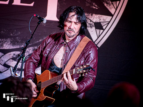 Aaron Bond on guitar