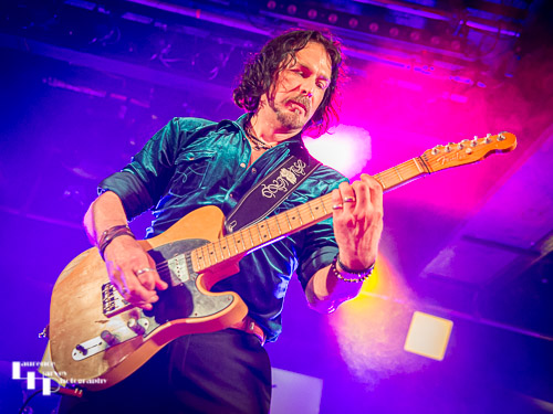 Aaron Bond on guitar & vocals