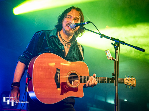 Aaron Bond on guitar & vocals