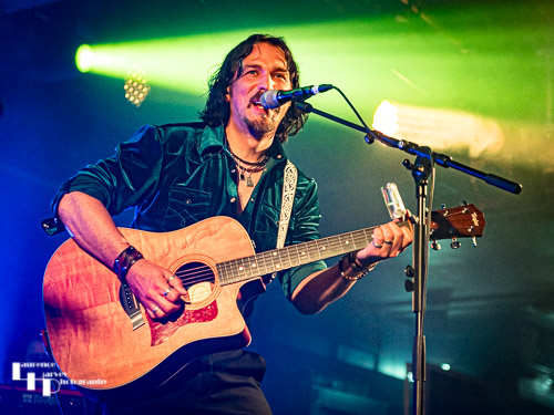 Aaron Bond on guitar & vocals