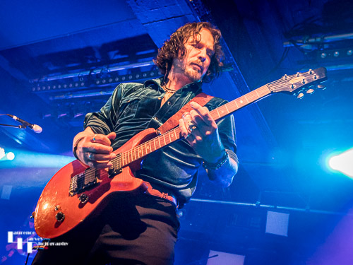 Aaron Bond on guitar & vocals