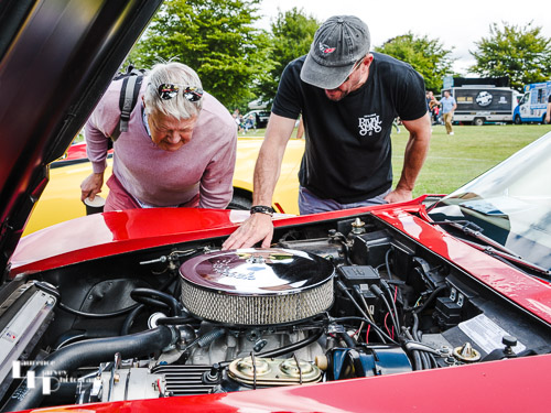 Owner & interested punter under the bonnet of a Red Corvette